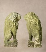 A pair of sculpted limestone profile reliefs of seated lions