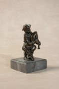 After Giambologna, (Flemish working in Italy, 1527 - 1608), a bronze model of a seated bagpiper