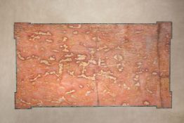A mottled pink white and orange marble veneered and green serpentine marble edged table top