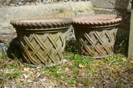 A pair of stone composition garden planters