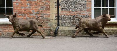 A pair of impressive cast iron garden models of bulls,