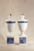 A pair of white marble and lapis lazuli mounted urns in Neoclassical style