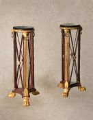 A pair of marble topped painted and parcel giltwood tripod pedestals in Neoclassical taste