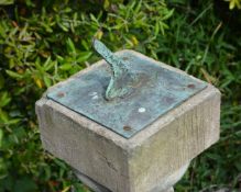 A bronze mounted stone composition garden sundial,