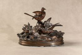 Jules Moigniez, (French 1835 -1894), a gilt bronze group of ground nesting birds with chicks,