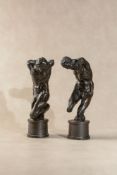 A pair of Continental patinated bronze models of men