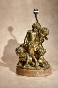 After Louis-Félix de La Rue, (French 1731 - 1765), a gilt bronze Bacchic group of a putto, two infan