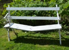 A painted wood and cast iron garden bench