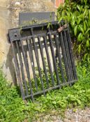 A pair of painted wrought iron gates loosely in Art Deco style