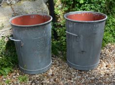 A pair of zinc twin handled vessels utilised as planters