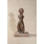 A northern European carved, stained and polychrome painted wood model of a maiden,