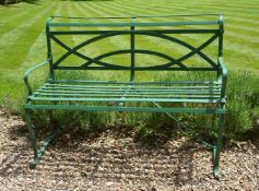A painted wrought iron garden bench in Regency style