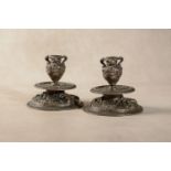 A pair of Venetian bronze candlesticks