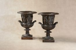 A pair of patinated bronze models of the Medici Vase