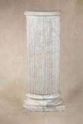 A substantial striated white marble columnar pedestal,