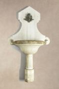 A Continental, probably Italian carved white marble wall fount and basin,