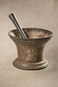 A substantial cast iron mortar and pestle
