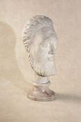 Continental school, 20th century, a sculpted veined white marble bust of a bearded man,