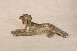 A gilt bronze model of a recumbent hound