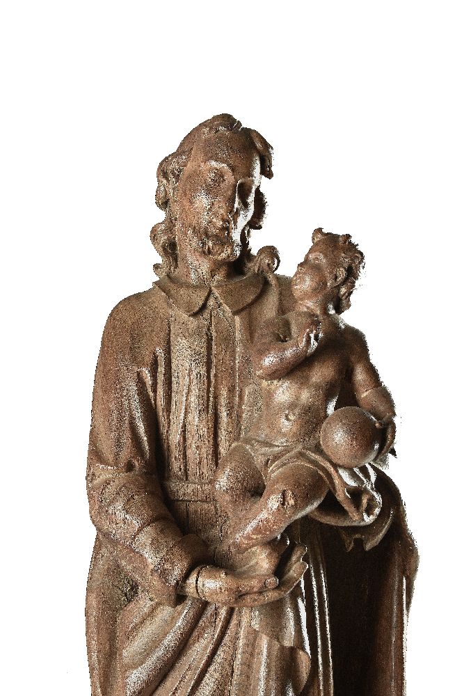 A sculpted oak group of Saint Joseph with the Infant Christ - Image 2 of 4