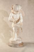 A north Italian sculpted alabaster model of a Cupid