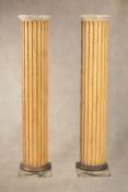 A pair of painted wood columnar pedestals,