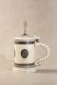 ϒ An ivory and silver coloured metal mounted tankard