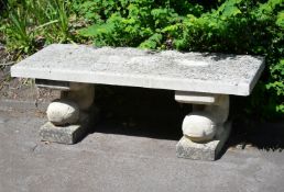 A cut and carved Portland stone garden seat