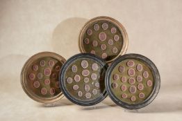 A set of four mounted and framed groups of red wax seal intaglios