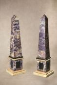 A pair of fine amethyst quartz veneered and marble mounted obelisks