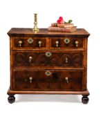A William & Mary olivewood oyster veneered and walnut banded chest of drawers