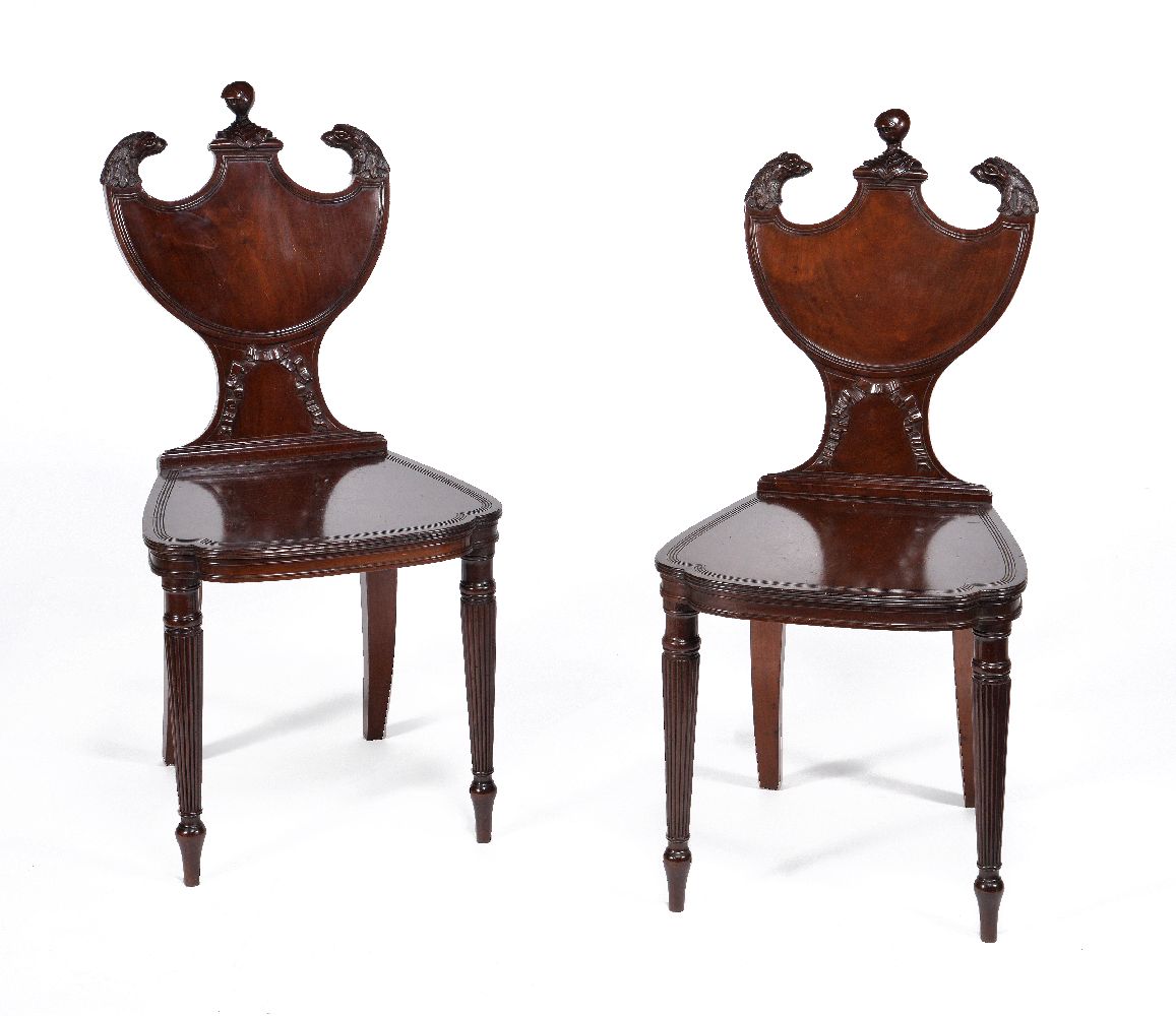 A pair of Regency mahogany hall chairs