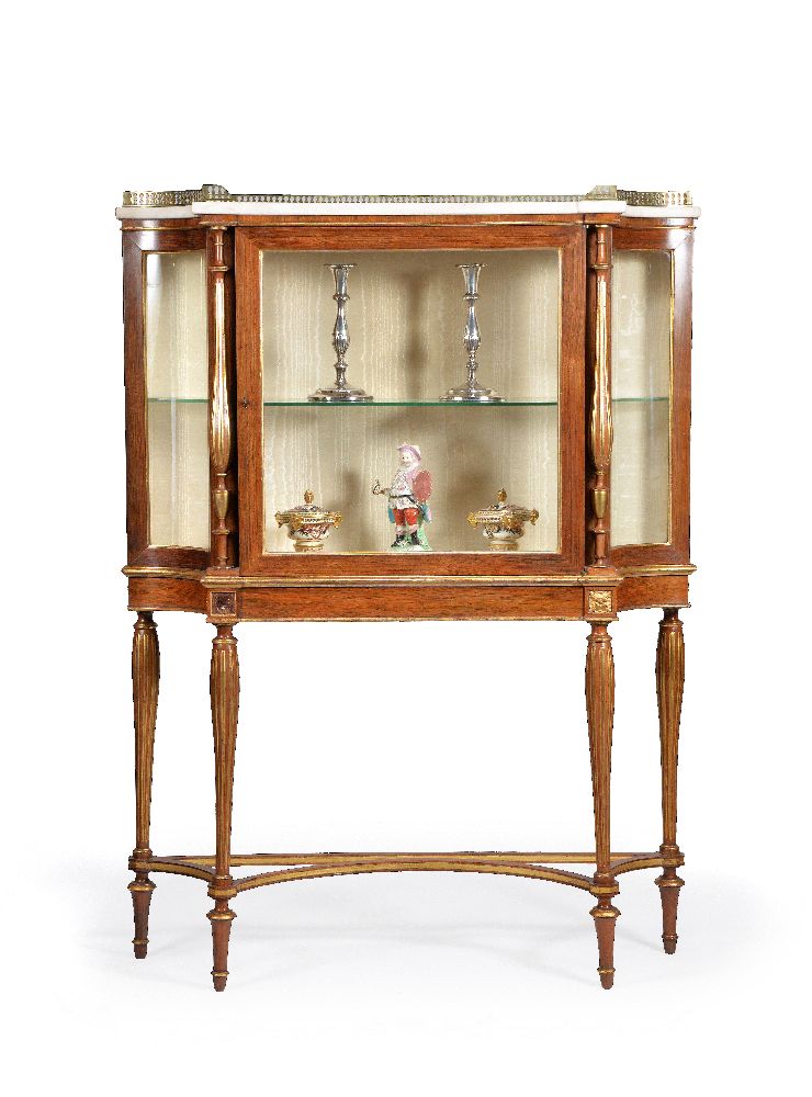 ϒ A Regency rosewood and parcel gilt cabinet on stand