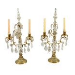 A pair of cut glass and rock crystal mounted gilt metal twin light candelabra in 18th century taste