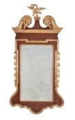 A George II mahogany and parcel gilt wall mirror