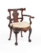 A carved mahogany desk armchair, in George II style, 19th century