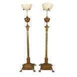 A pair of French gilt metal and copper mounted standard oil lamp bases in Neoclassical style