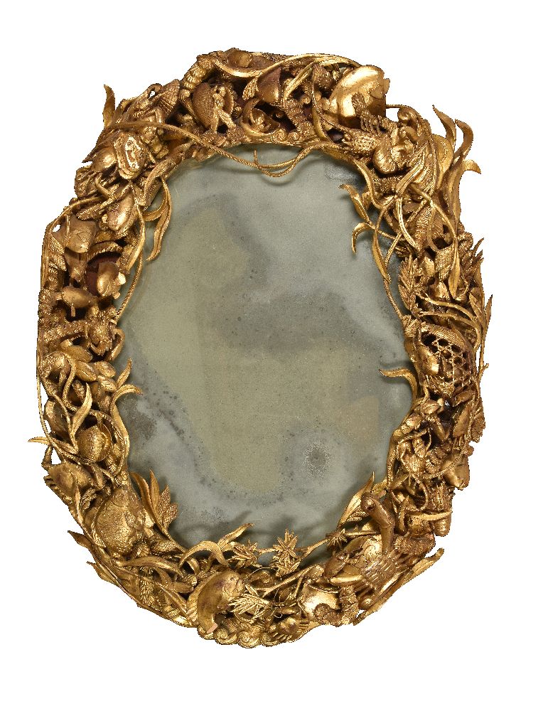 A carved giltwood oval wall mirror