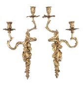 A set of four gilt bronze twin light figural wall appliques in Louis XV style