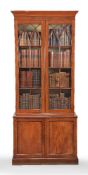 A pair of mahogany cabinet bookcases in George III style