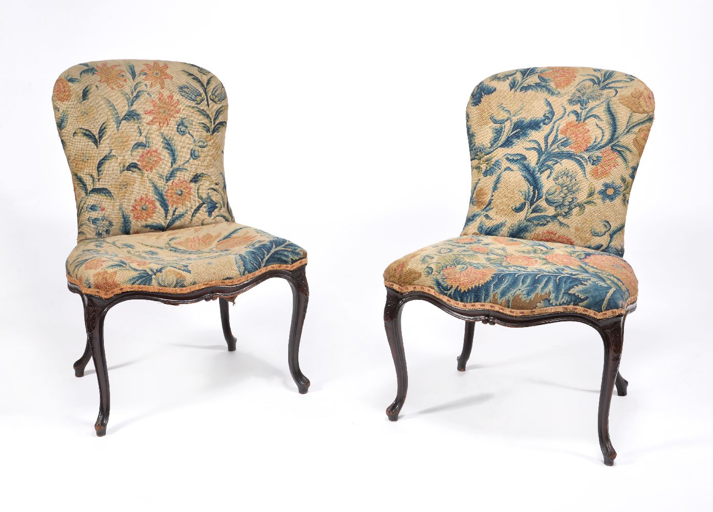 A pair of George III mahogany and needlework upholstered side chairs