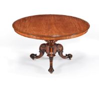 A Victorian satinwood and rosewood circular centre table