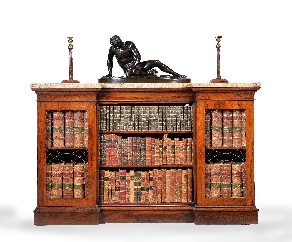 ϒ A Regency rosewood and marble mounted inverted breakfront bookcase