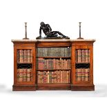 ϒ A Regency rosewood and marble mounted inverted breakfront bookcase