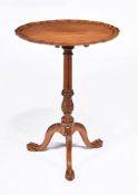 A Victorian walnut tripod table