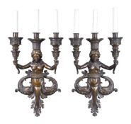 A pair of Continental patinated bronze three light figural wall appliques in Renaissance Revival tas