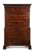 A George III mahogany secretaire chest on cabinet
