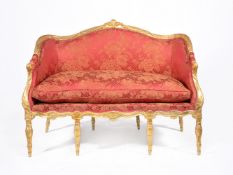 A George III carved giltwood settee