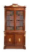 A pair of French mahogany and gilt metal mounted cabinet bookcases