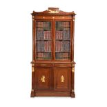 A pair of French mahogany and gilt metal mounted cabinet bookcases